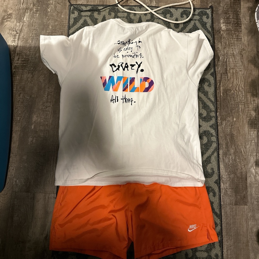 Nike White Tee with Multicolor Text and Orange Shorts